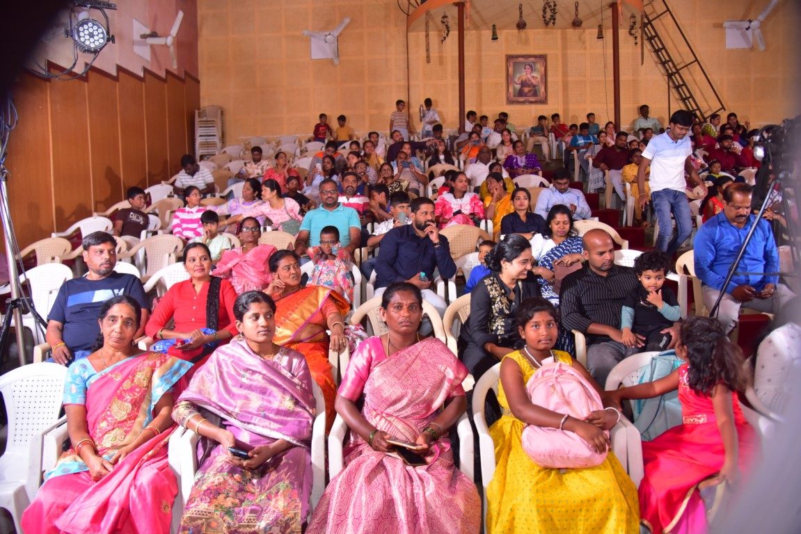 Families seated in the auditorium