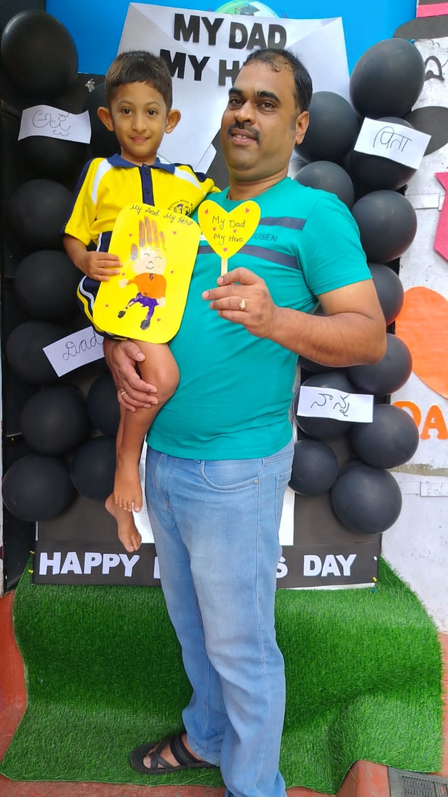 A father and child at the school celebration